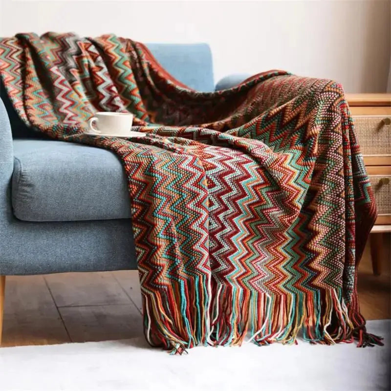 Couverture tricotée à la main avec pompon