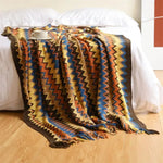 Hand-knitted blanket with pompom - Vignette | Couvertures Cosy