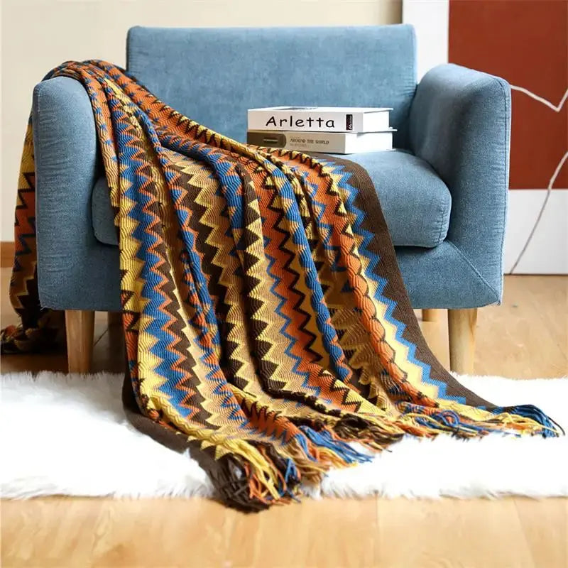 Couverture tricotée à la main avec pompon